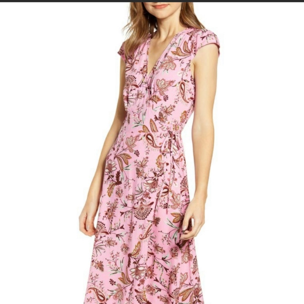 Love stitch wrap dress in pink floral design. Cute for spring or cover up style.